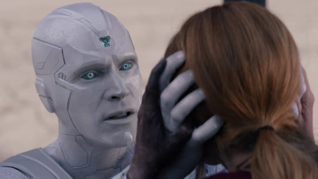 Vision Blanc pone sus manos en la cabeza de Wanda en WandaVision